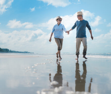Asian couple senior elder retire resting relax walking running at sunset beach honeymoon family together happiness people lifestyle